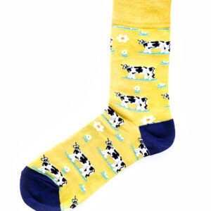 Chaussettes jaunes et bleu foncé, avec motifs de vaches noires et blanches. Taille unique.